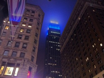 The Empire State Building, partially obscured by low clouds